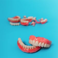 Learn About The Pros And Cons Of Traditional Dentures